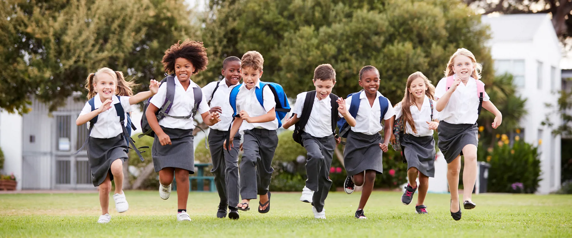 School children running on the field