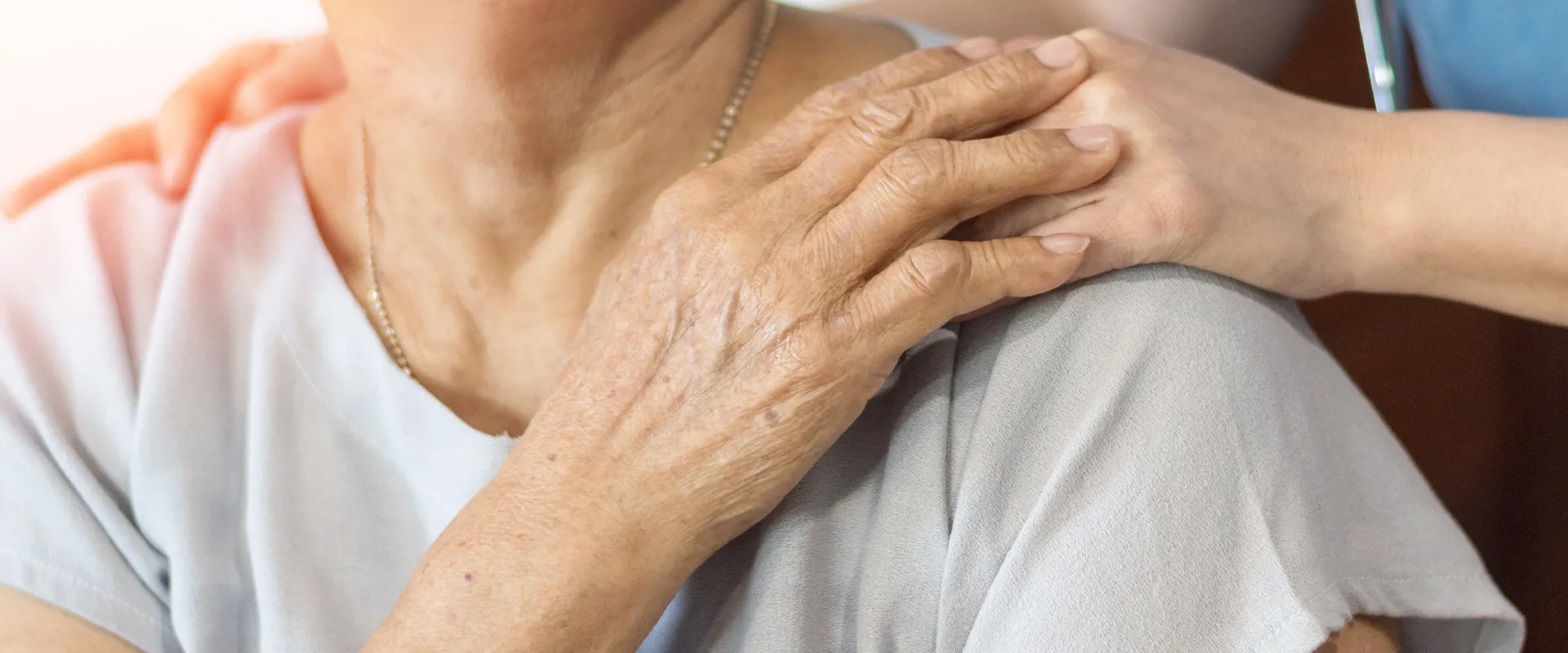 Healthcare professional supporting an elderly community member