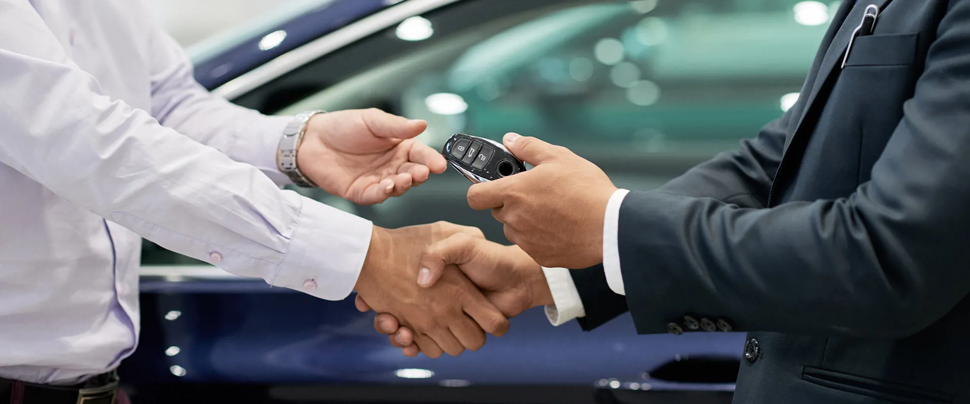 Businessman purchasing a vehicle in a car salon