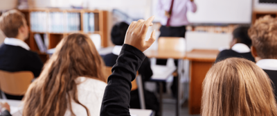 Classroom, girl with hand up