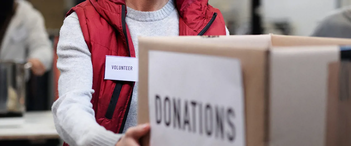 Volunteer collecting charity donations