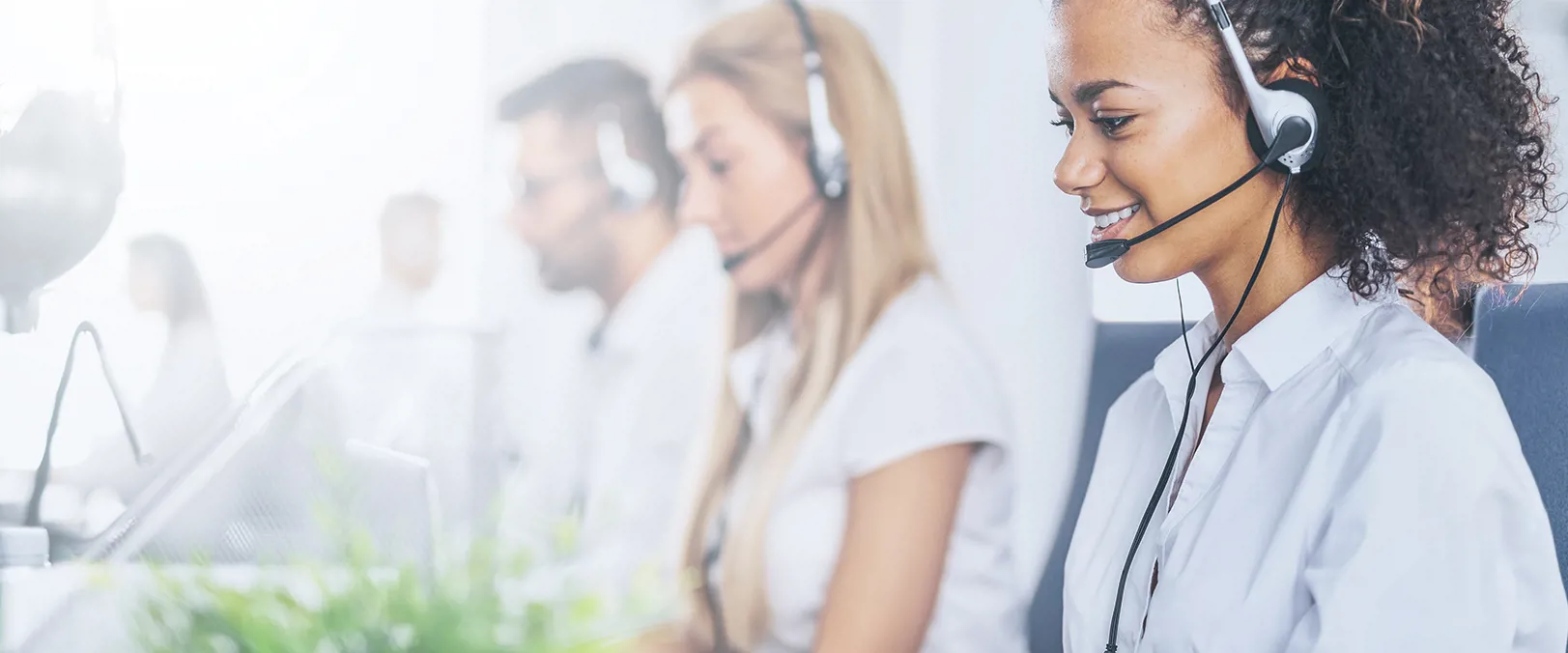 Employee support workers using a headset and giving advice over the phone