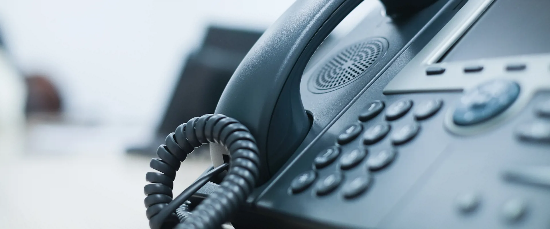 Communication and telephony device standing on the desk in the office